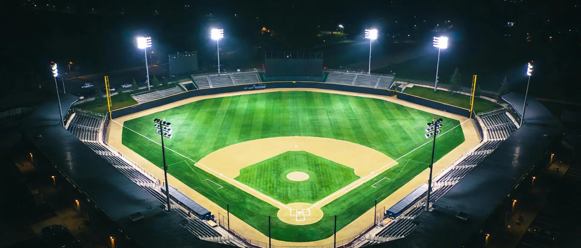 High mast LED lights illuminating a baseball sports field