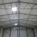 UFO LED high bay lights installed in a logistics warehouse