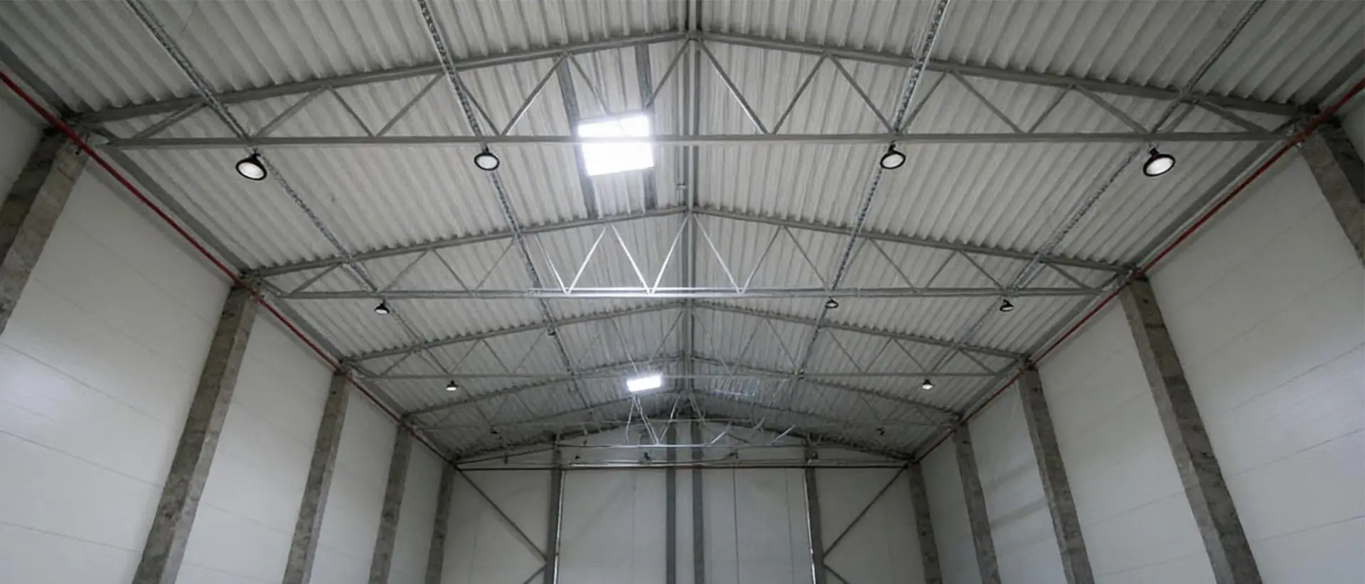UFO LED high bay lights installed in a logistics warehouse