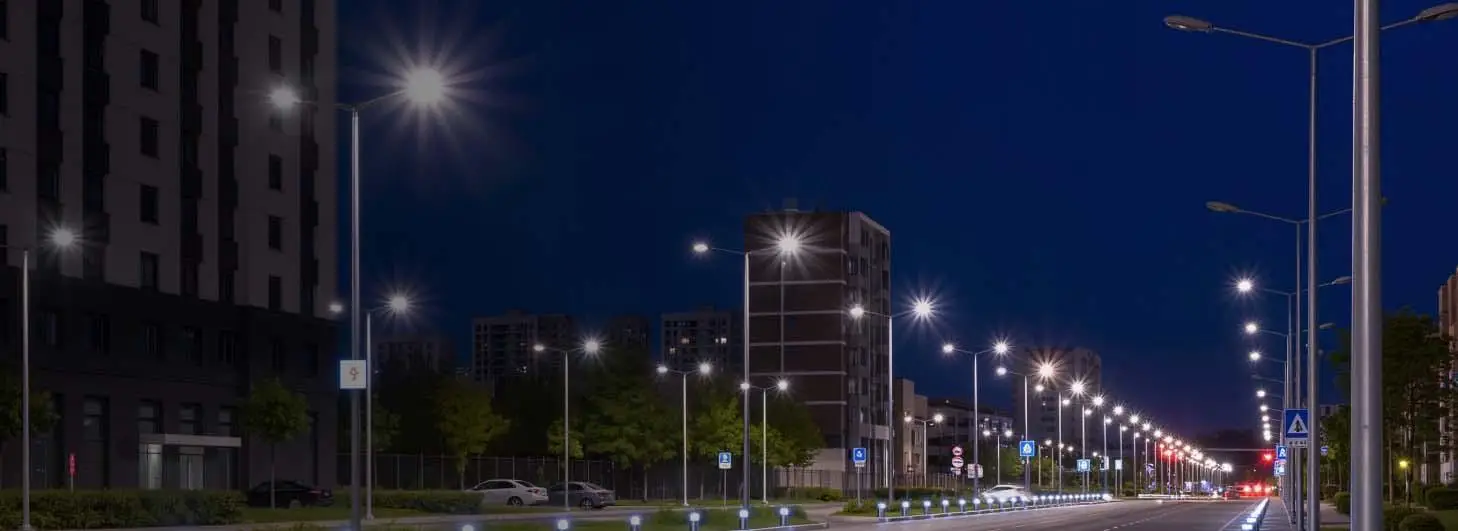 Street lighting poles along a parking lot roadway in Japan